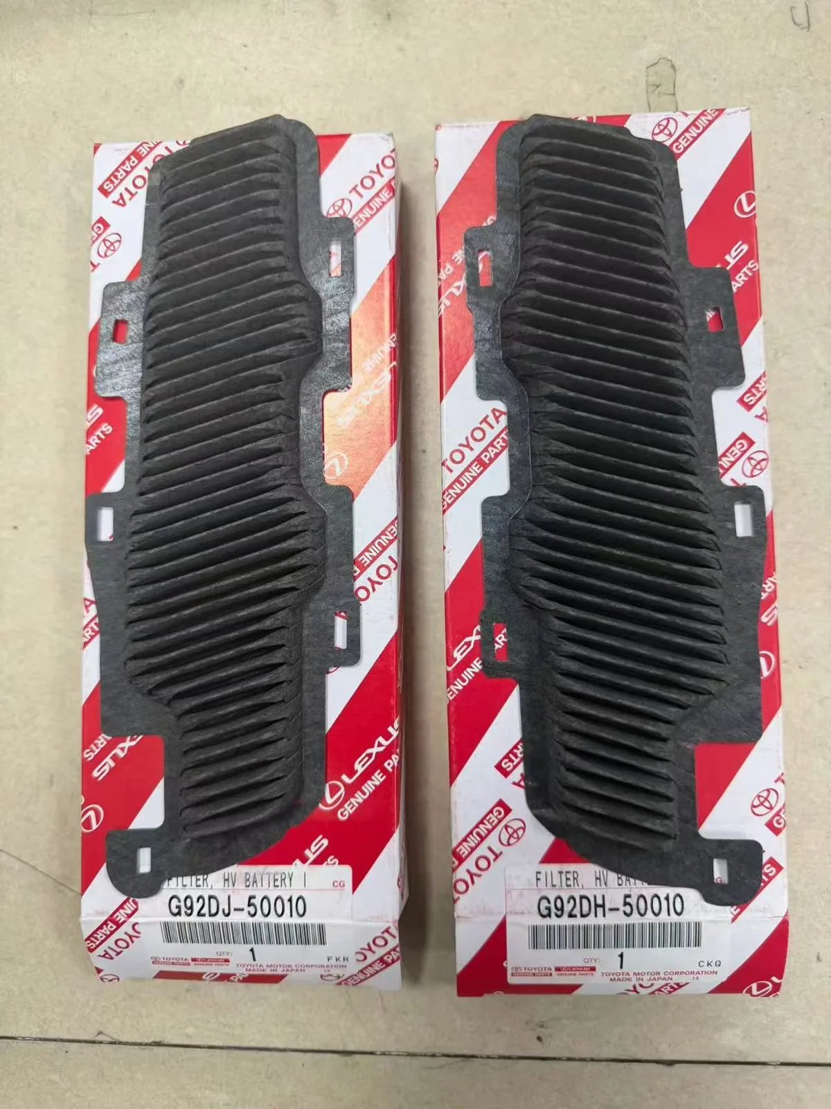 Two hybrid vehicle battery filters with boxes labeled G92DJ-50010